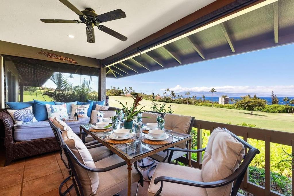 a patio with a table and chairs on a balcony at Kaanapali Plantation 9 · KPL 9 Panoramic Ocean Views Kaanapali N in Lahaina