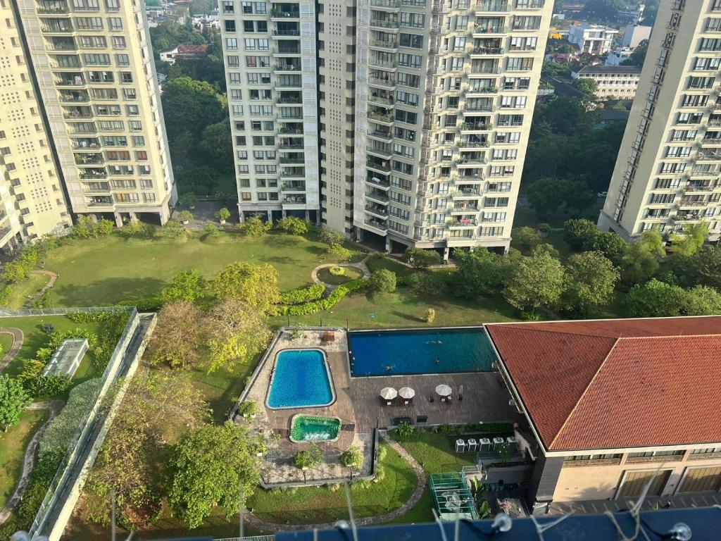 an aerial view of a building with a swimming pool at Gems Havelock Apartment in Colombo