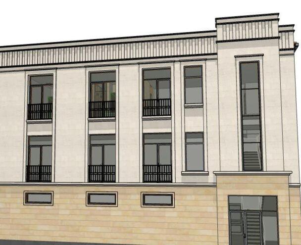 a large building with windows on the side of it at Luxury Collection Hotel in Sevan