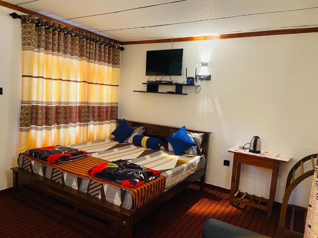 Postel nebo postele na pokoji v ubytování Nine arch echo Villa Ella