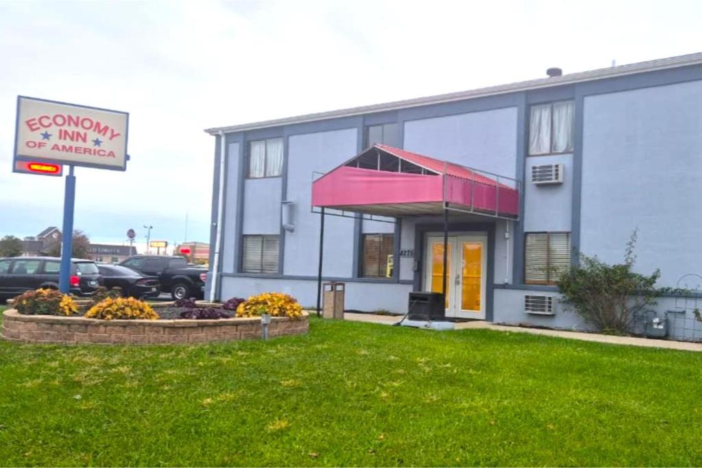 a building with a sign in front of it at Economy Inn By Townhouse Merrillville US 30 in Merrillville