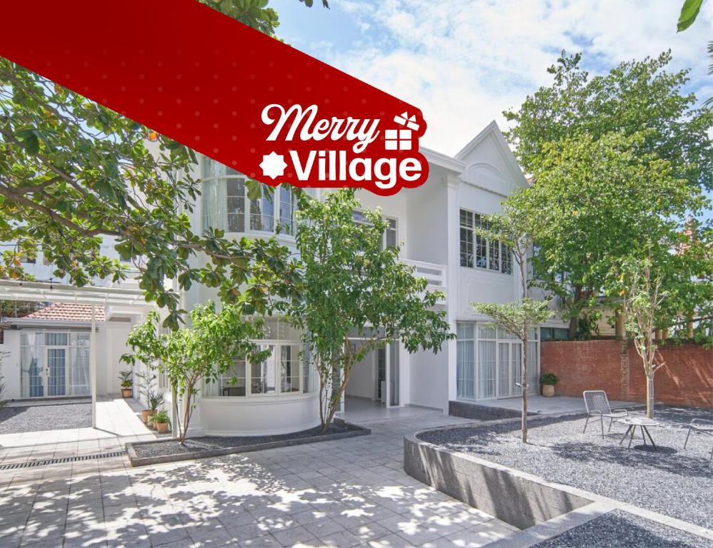a house with a sign that reads merry village at M Village Living 47 Thảo Điền in Ho Chi Minh City