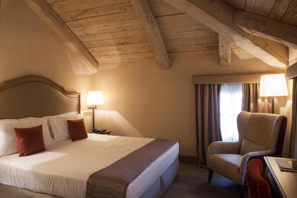Postel nebo postele na pokoji v ubytování Palazzo Righini