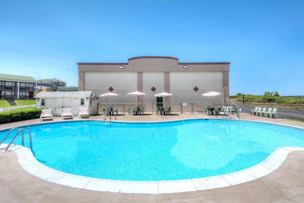 a large swimming pool in front of a building at Express Inn Harrisburg South New Cumberland in New Cumberland