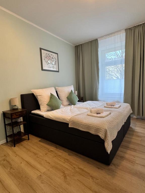 Ένα ή περισσότερα κρεβάτια σε δωμάτιο στο Arminos Apartment