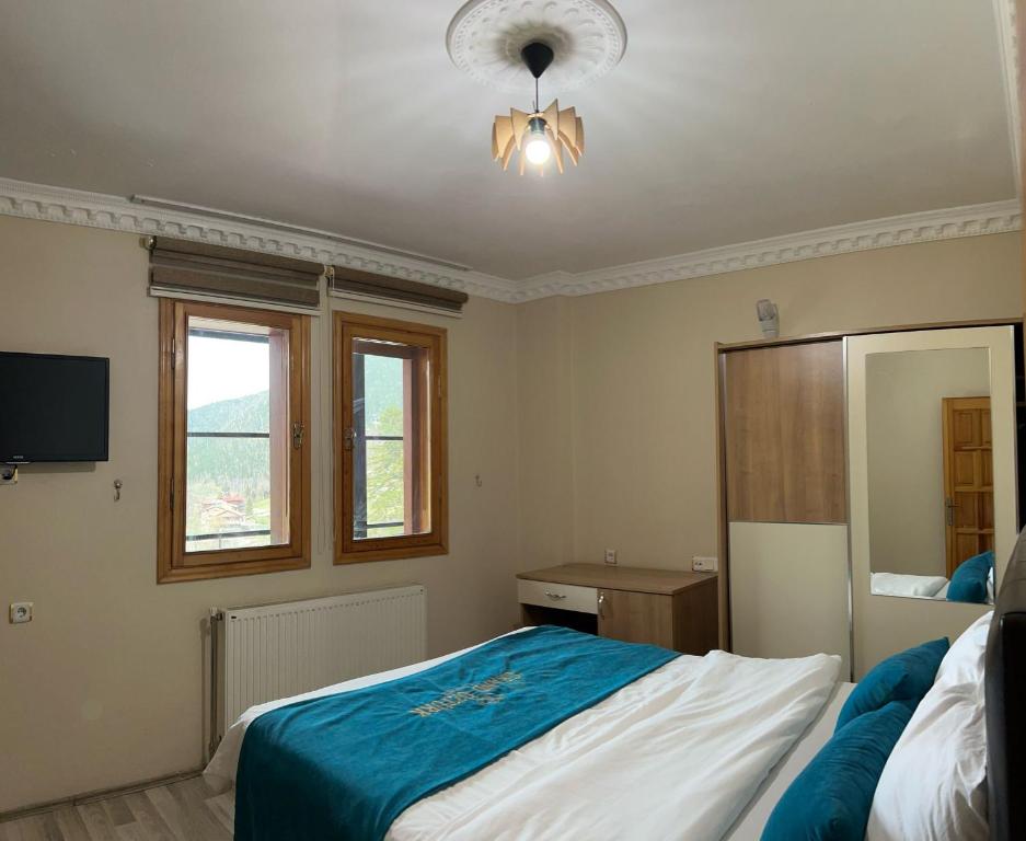 Postel nebo postele na pokoji v ubytování Duha Uzungöl Apart Otel