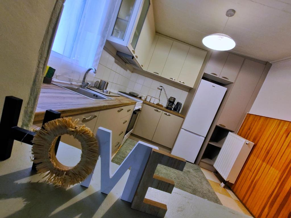 a kitchen with a sign that says love in the middle at Citadel's Tranquility Ioannina in Ioannina