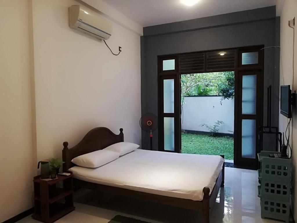 Ένα ή περισσότερα κρεβάτια σε δωμάτιο στο Menuks villa