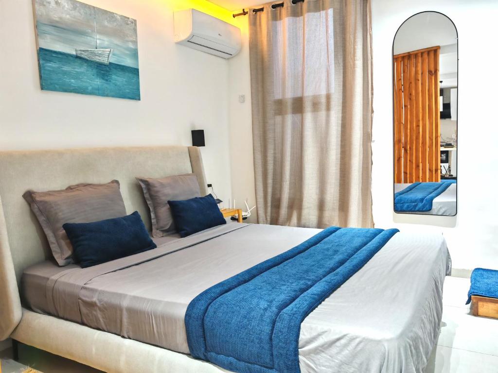 Ένα ή περισσότερα κρεβάτια σε δωμάτιο στο Le Jasmin Appartement