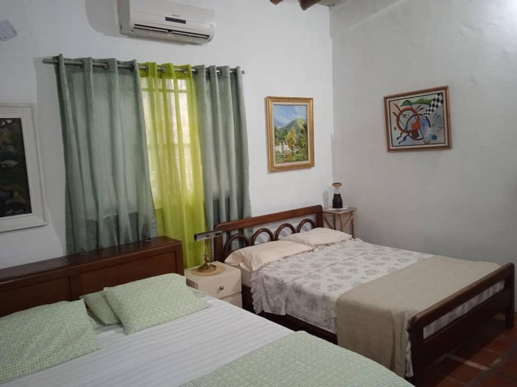 Ένα ή περισσότερα κρεβάτια σε δωμάτιο στο La chulinga
