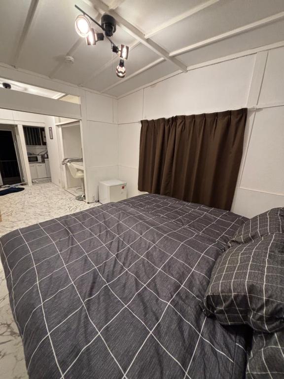 a bedroom with a large bed in a room at BUNKA HOUSE OSAKA room d in Osaka