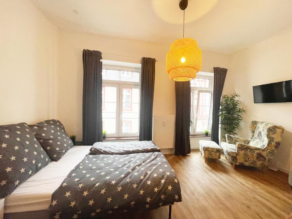 Ένα ή περισσότερα κρεβάτια σε δωμάτιο στο Charmantes Studio-Apartment in der Altstadt Koblenz