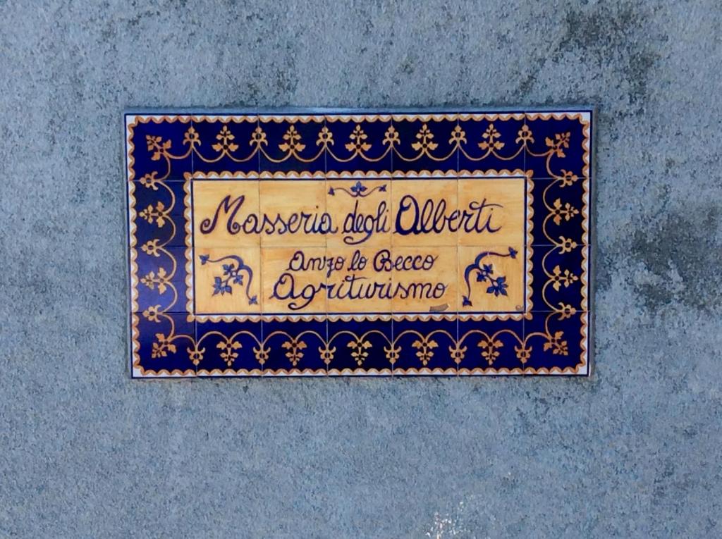 a sign that reads las vegas and undroit arrive to create agriculture at Masseria degli Alberti in Mormanno