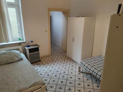 En eller flere senge i et værelse på Speedstay Marxloh