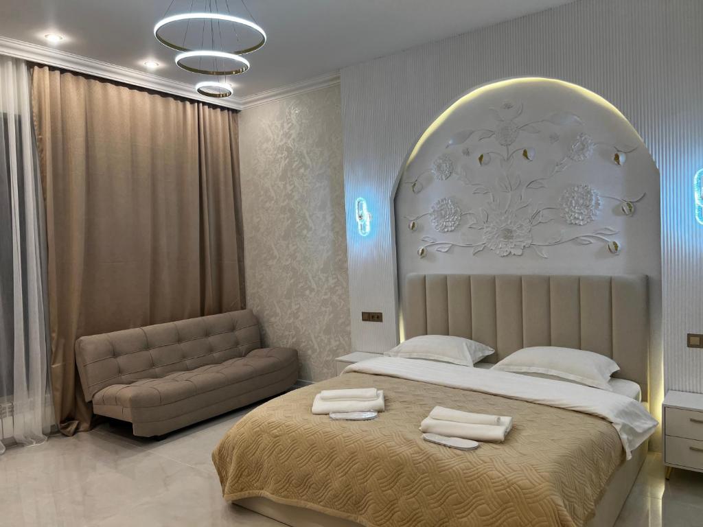 En eller flere senge i et værelse på Lion Vip Hotel