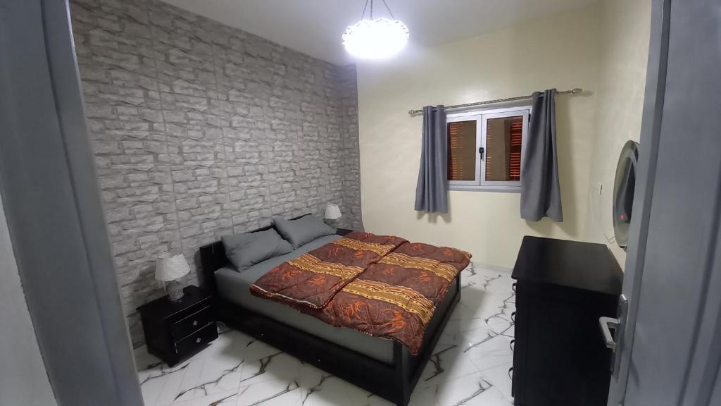 Postel nebo postele na pokoji v ubytování Tantan plage océan