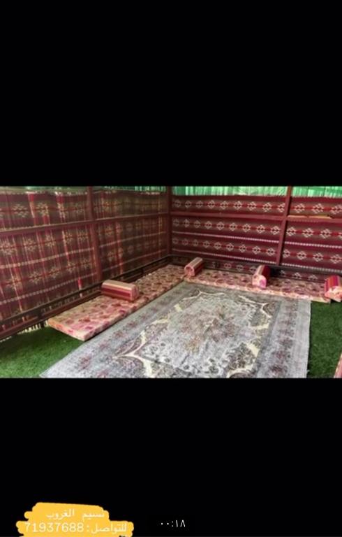 a picture of a room with a wall at قريه الواصل in Shāhiq