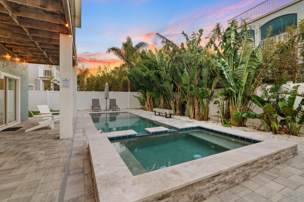 a swimming pool in the backyard of a house at Aqua Vista l Beach Views I Pool Spa in Butler Beach