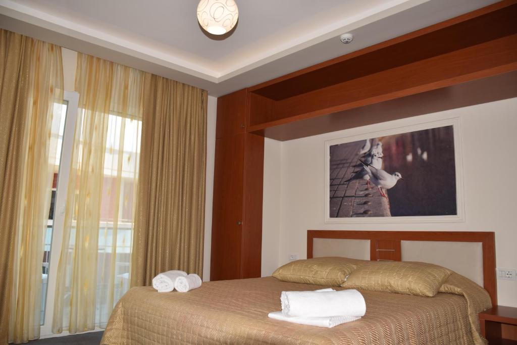 Postel nebo postele na pokoji v ubytování Hotel Pogradeci 2