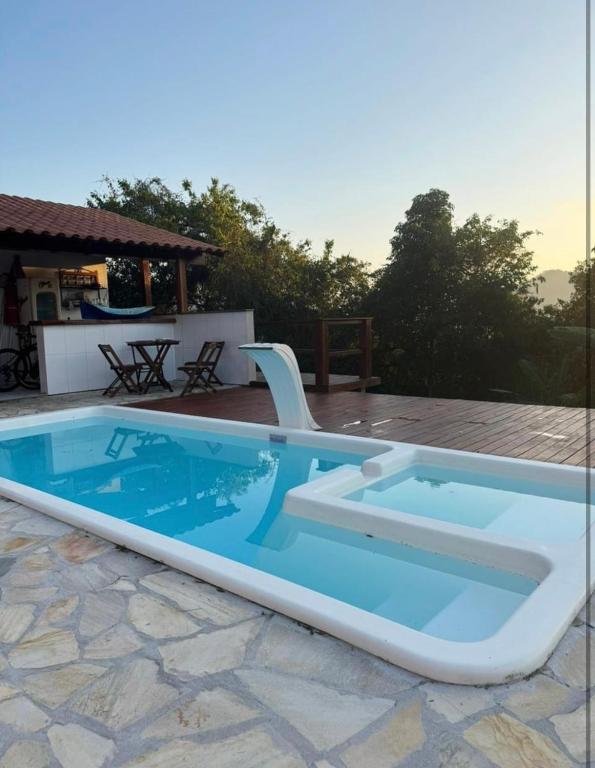 a large swimming pool sitting on top of a patio at Pousada Green House Paraty in Paraty