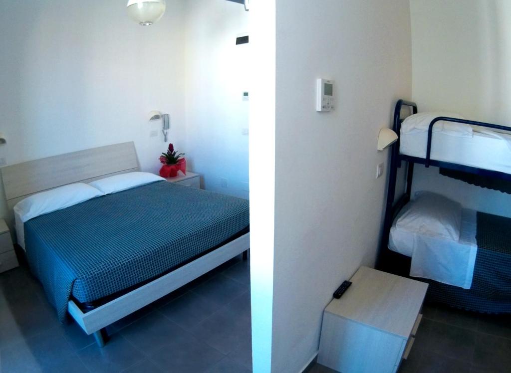 Postel nebo postele na pokoji v ubytování Hotel Atlas