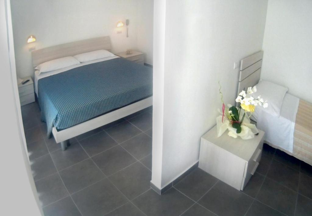 Postel nebo postele na pokoji v ubytování Hotel Atlas