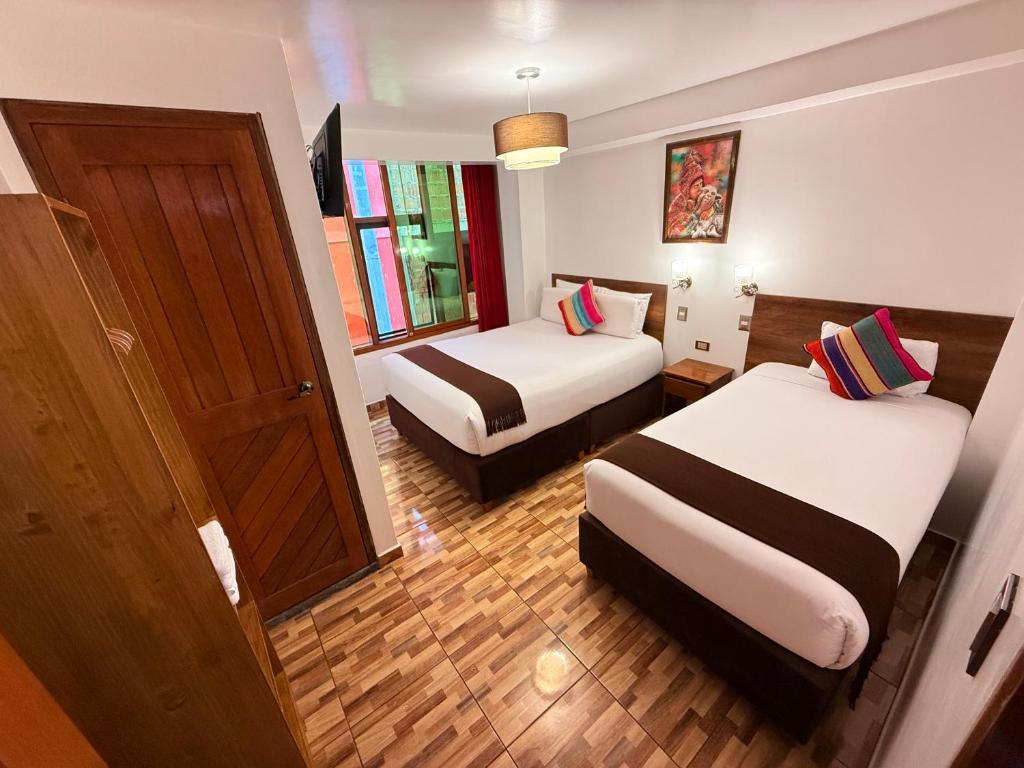 Postel nebo postele na pokoji v ubytování Inti Pacha Palace Machupicchu