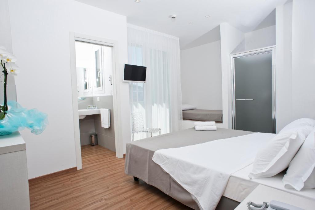 Postel nebo postele na pokoji v ubytování Hotel Atlas