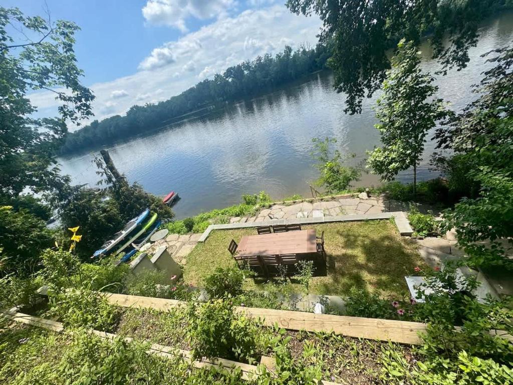 a house on a island in the middle of a lake at Charming & Whimsical Historic River Home in Titusville