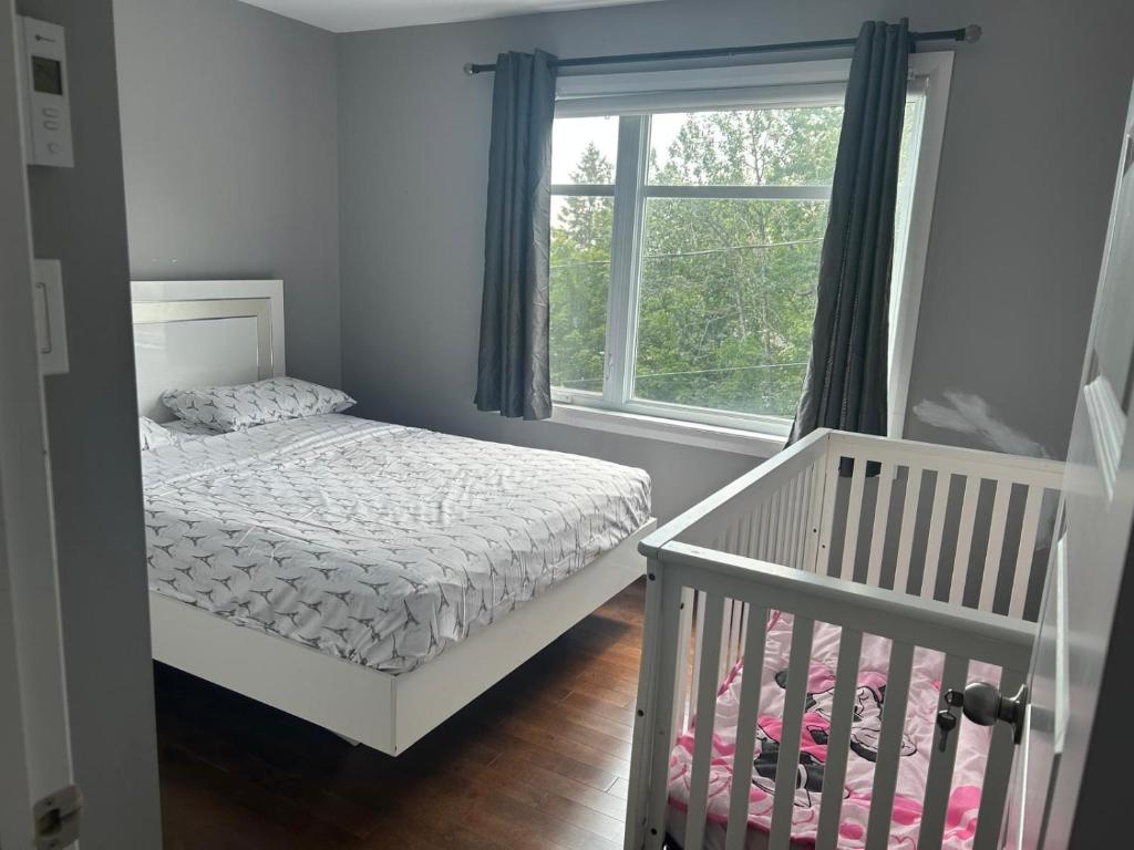 Giường trong phòng chung tại Detente