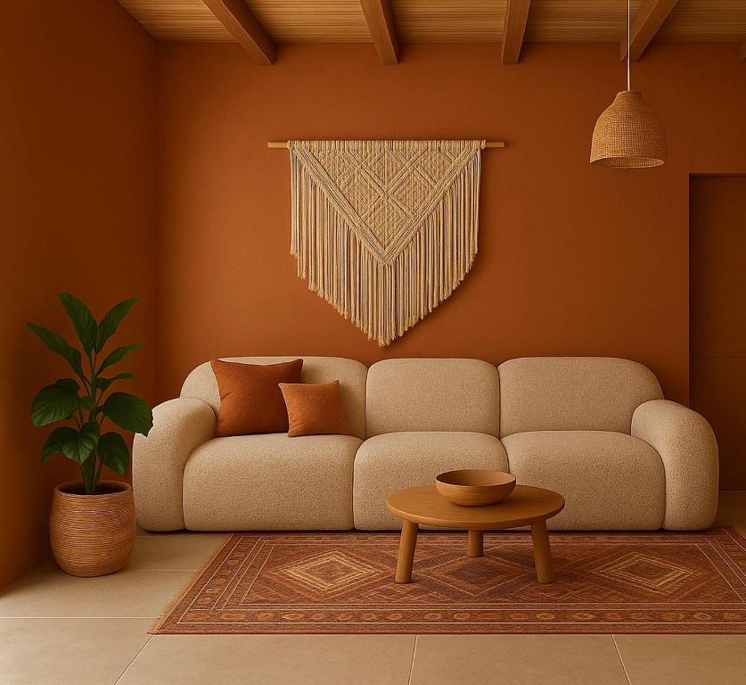 a living room with a couch and a table at Katoi suite in Éxo Khóra