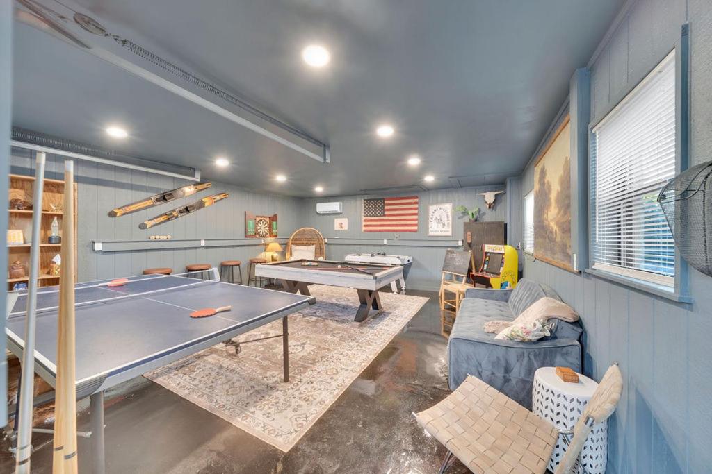 a ping pong room with a ping pong table at The Brass Tulip in Tulsa