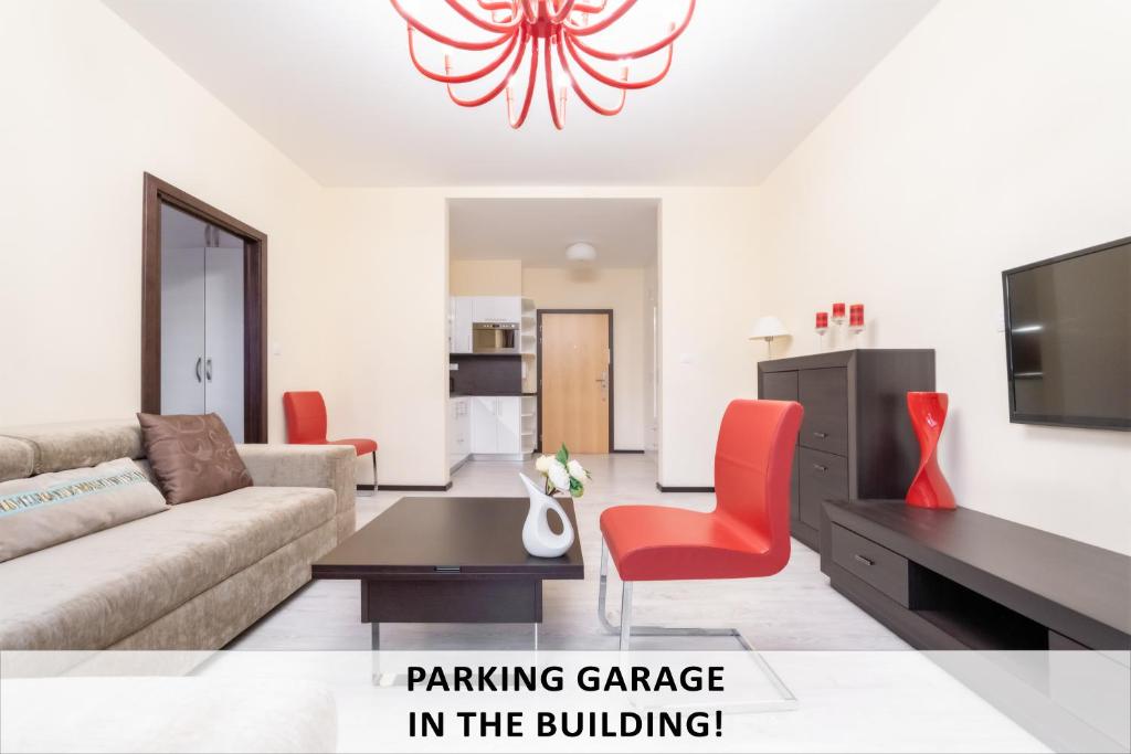 a living room with a couch and a table at Imperial Apartment in Bohemia Residence by Rentez in Karlovy Vary