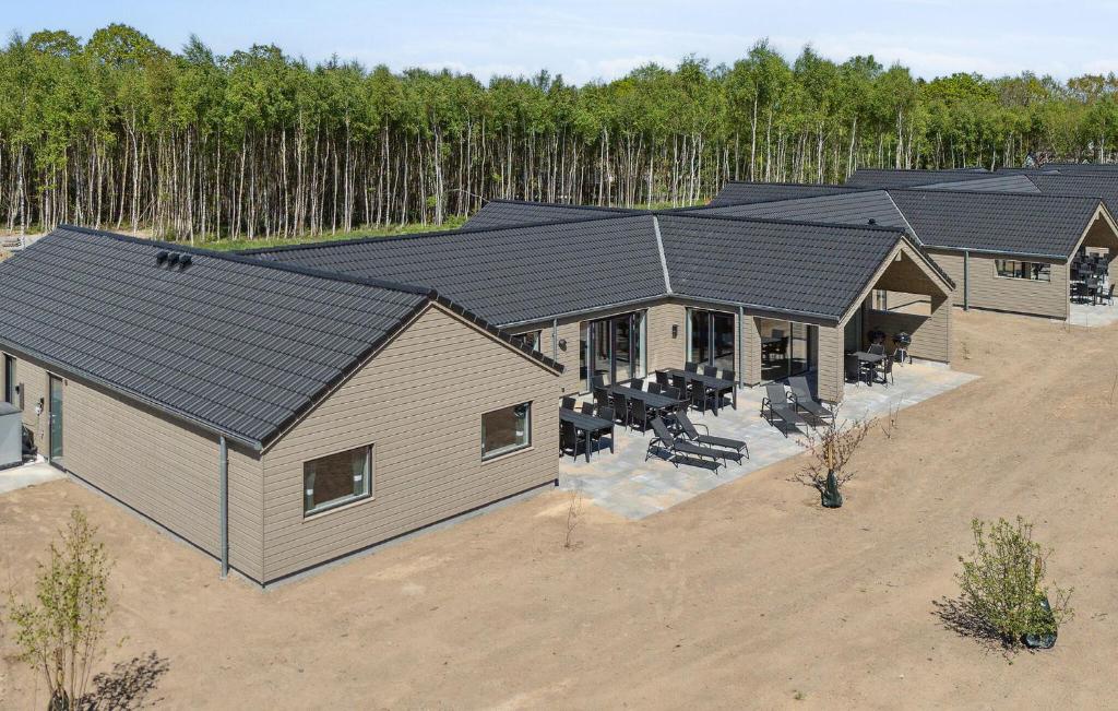 an overhead view of a house with a roof at Awesome Home In Glesborg With Sauna in Fjellerup