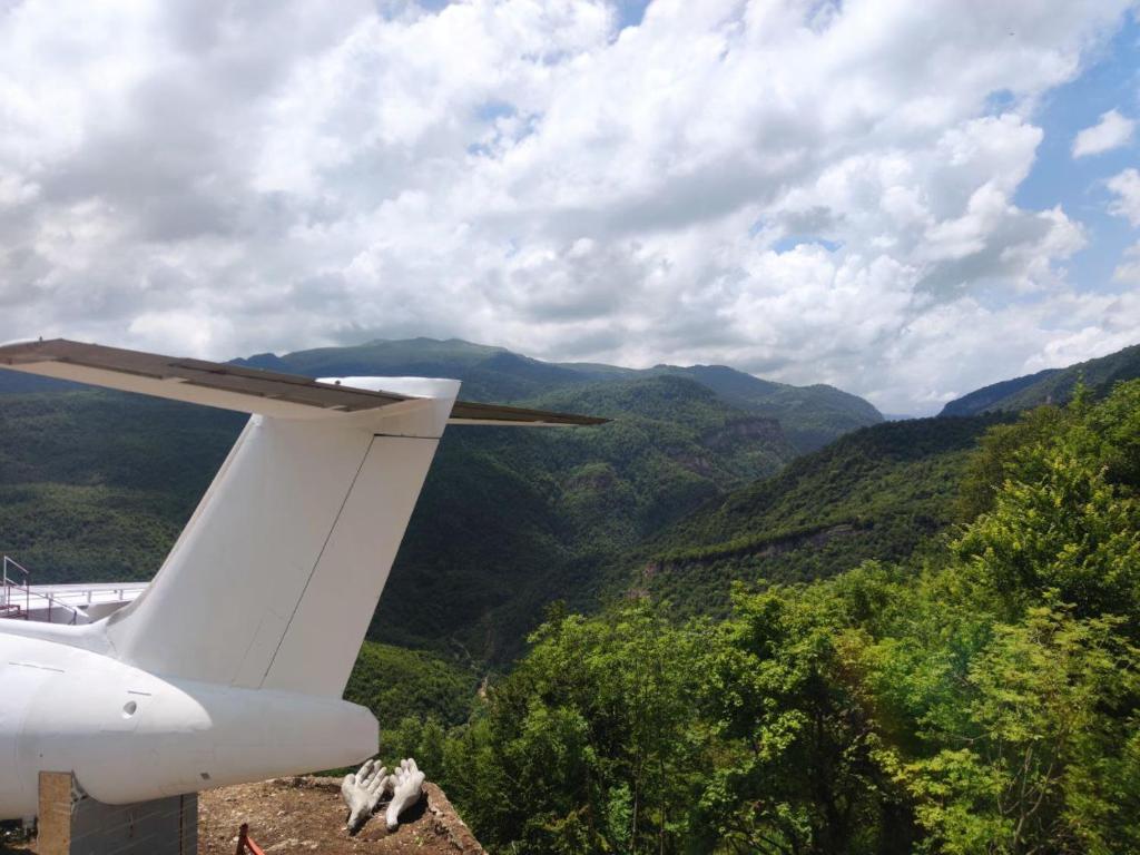 a close up of the tail end of an airplane at Lostin clouds in Yenokavan