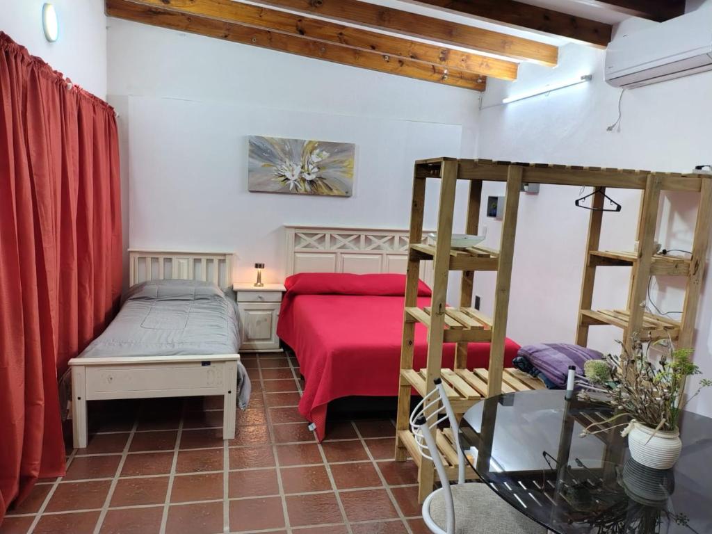 Postel nebo postele na pokoji v ubytování La Carolina Cabañas