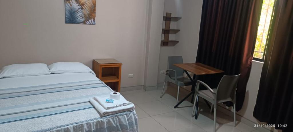 Ένα ή περισσότερα κρεβάτια σε δωμάτιο στο Hostal Vilchez