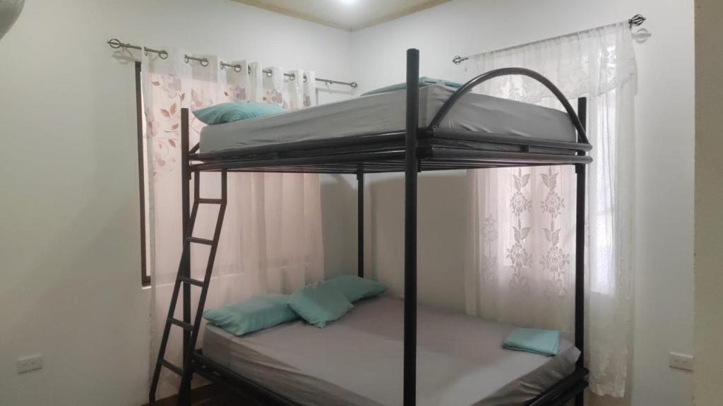 Postel nebo postele na pokoji v ubytování Lodge Mar y Sol