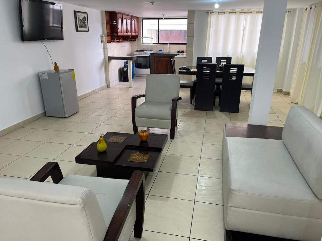 a living room with a couch and a table at Real Audiencia Living in Quito