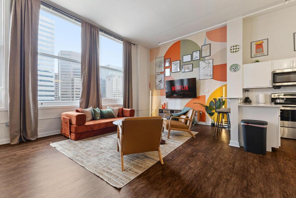 a living room with a couch and a table at New Skywalk Access- Downtown Work Retreat- Sleeps8 in Indianapolis