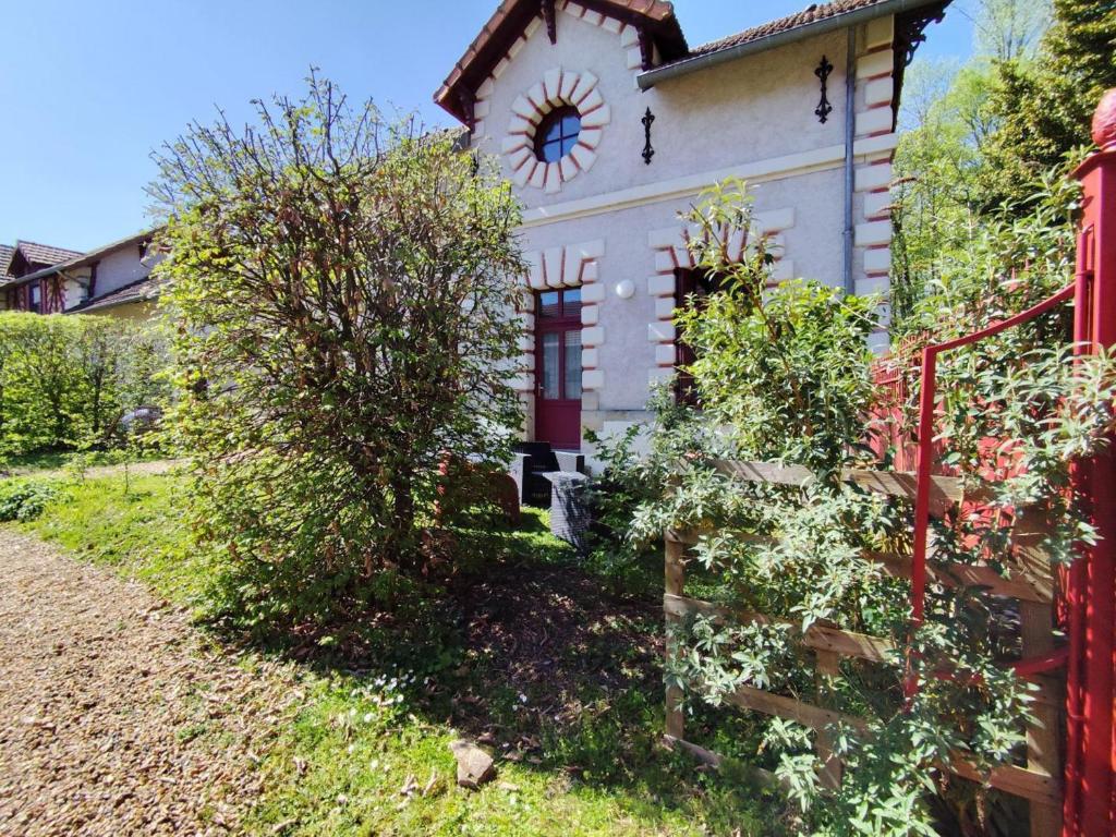 a house with a clock on the side of it at Gîte de charme avec parking, animaux admis, proche de Tours - FR-1-381-638 in La Riche
