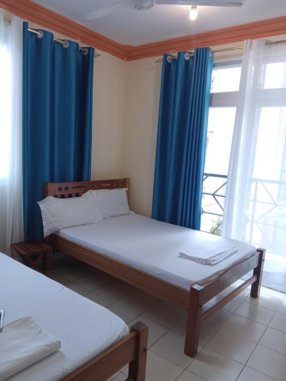 Postel nebo postele na pokoji v ubytování Mtwapa Luxurious with Pool 102