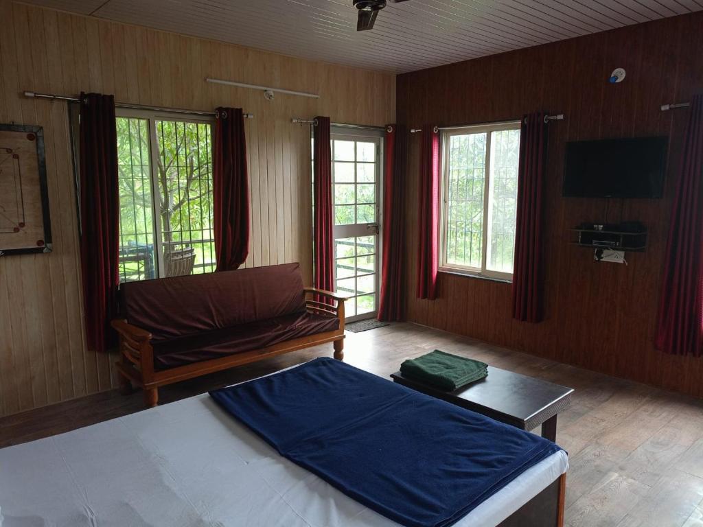 Ένα ή περισσότερα κρεβάτια σε δωμάτιο στο Bima Farm