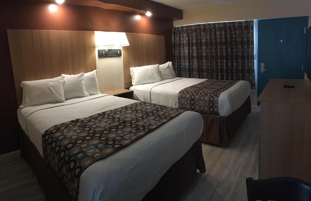 Postel nebo postele na pokoji v ubytování Seahorse Inn