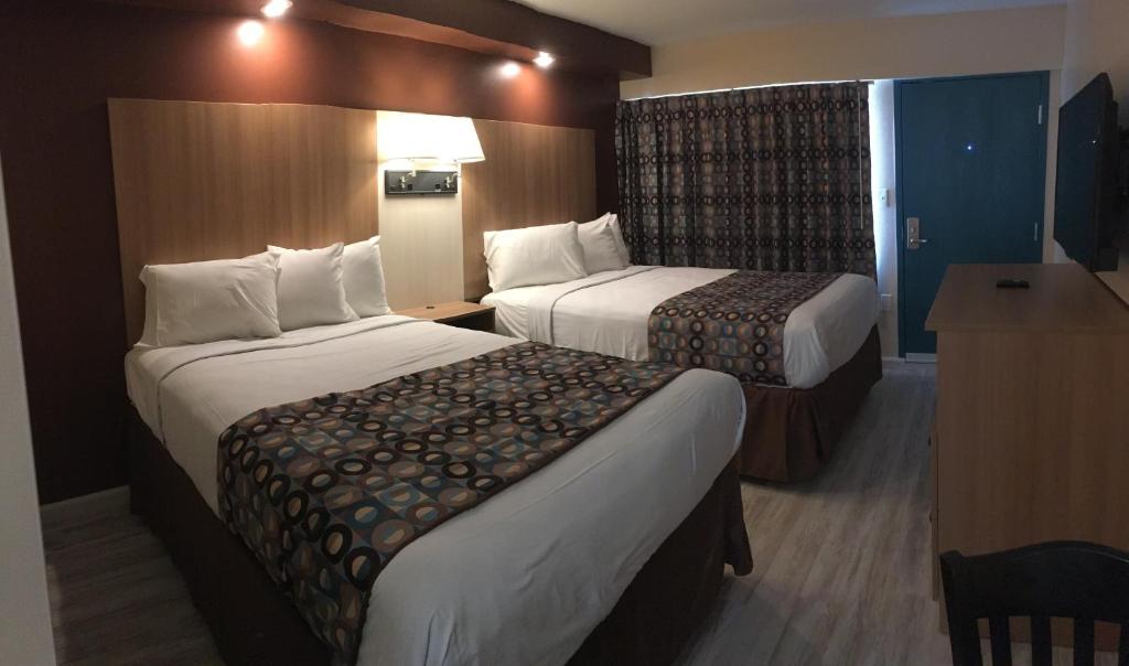 Postel nebo postele na pokoji v ubytování Seahorse Inn