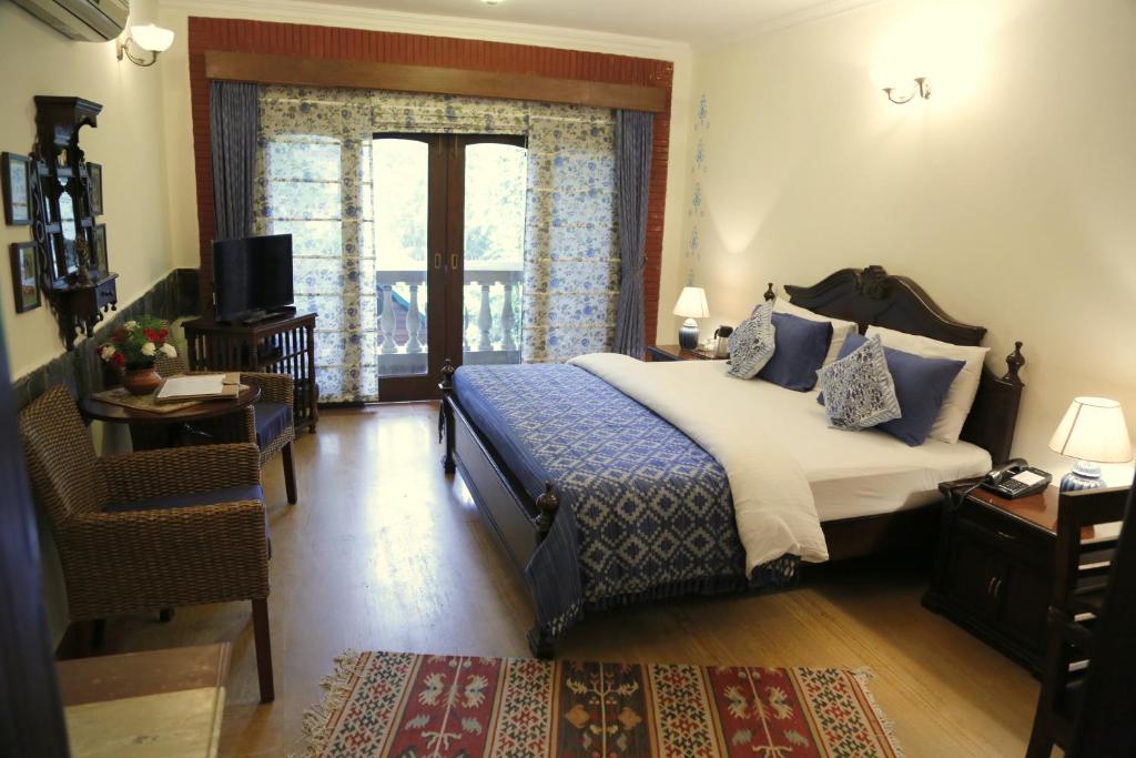 Postel nebo postele na pokoji v ubytování The Estate Villa