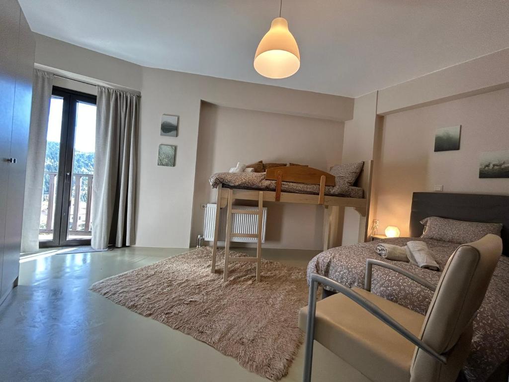 a bedroom with two bunk beds and a rug at The Black Chestnut in Áyios Nikólaos