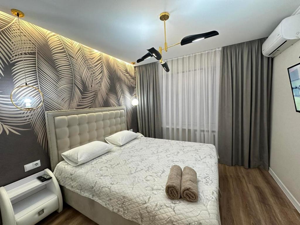 En eller flere senge i et værelse på Sweethome Riscani