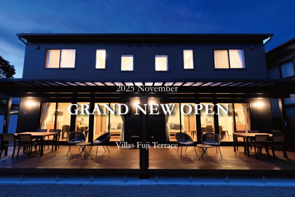 a group of chairs sitting in front of a building at Villas Fuji Terrace ヴィラス富士テラス in Fujikawaguchiko