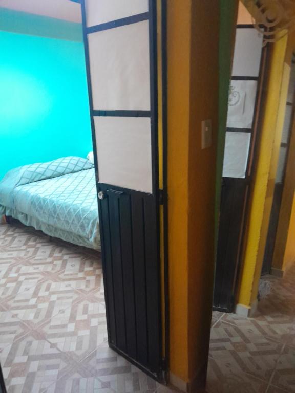 Ένα ή περισσότερα κρεβάτια σε δωμάτιο στο Guanajuato Beli